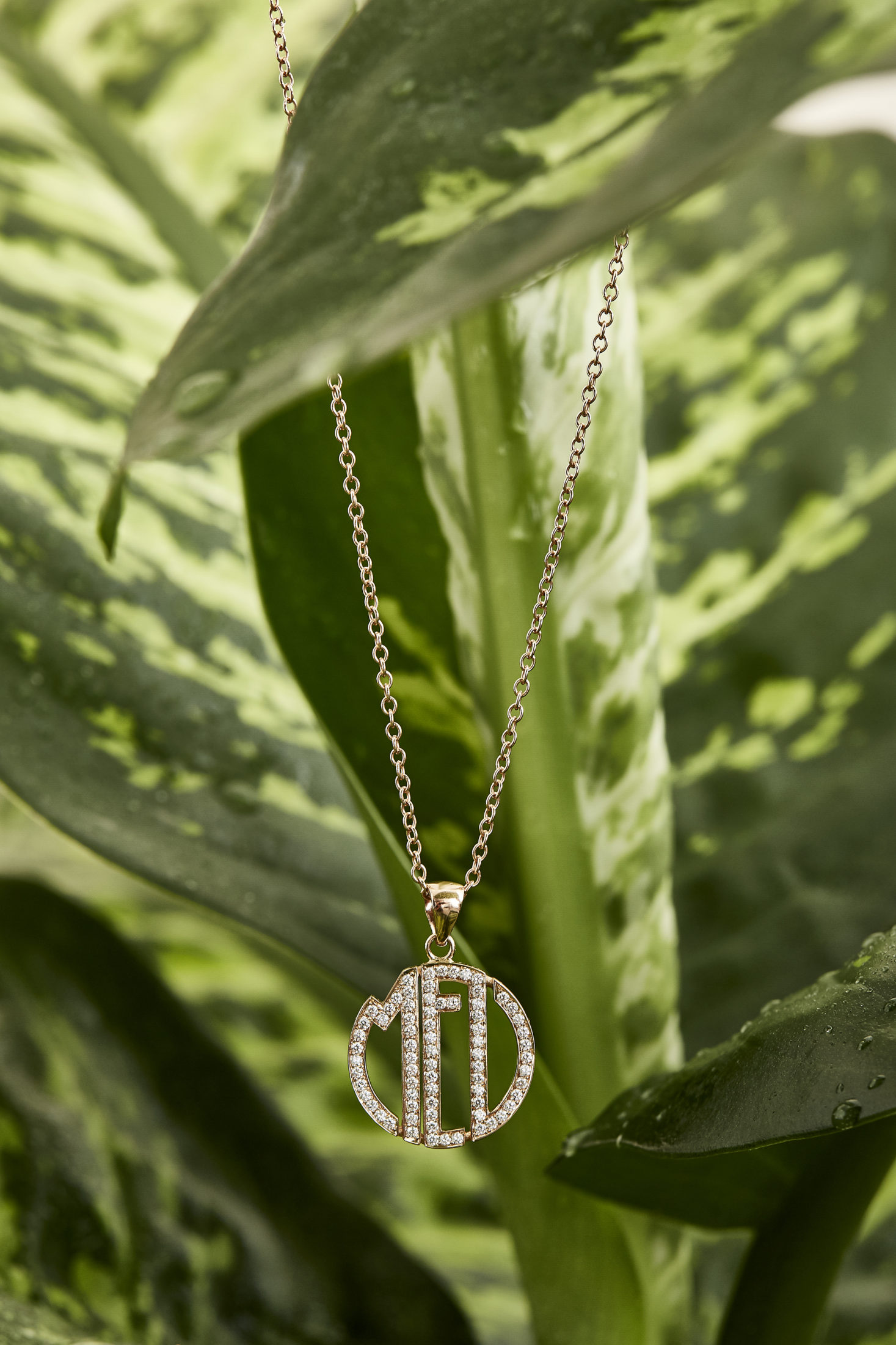 MEL - Ciondolo con logo catena in oro rosa e brillanti.