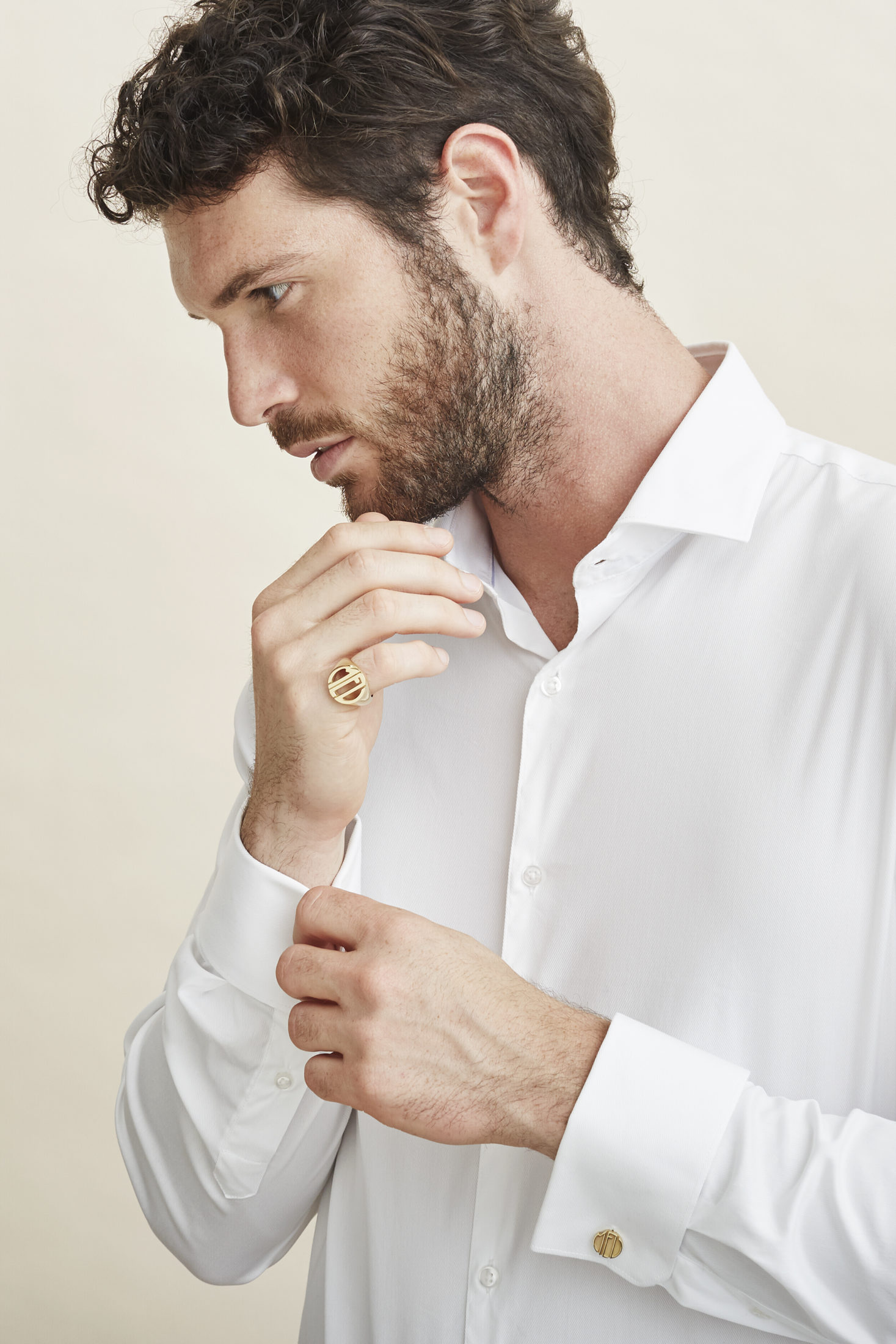 MEL - Logo rings and cufflinks in yellow gold.